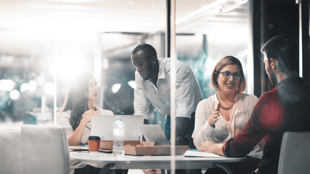 Sales team collaborating and closing deals using Dynamics 365 for Sales, equipped with real-time insights and productivity tools.